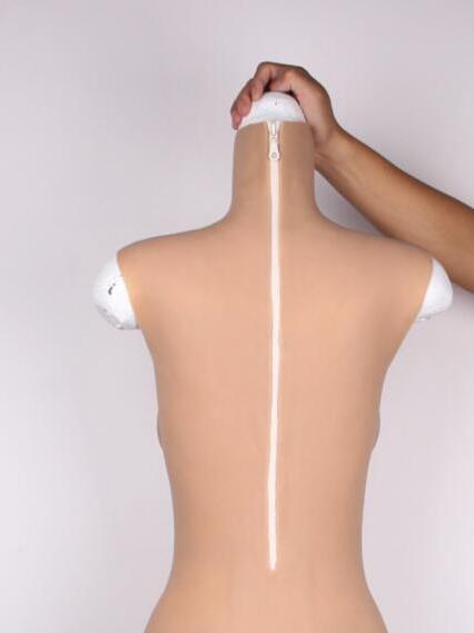 Dtails of back zipper of silicone fullbody